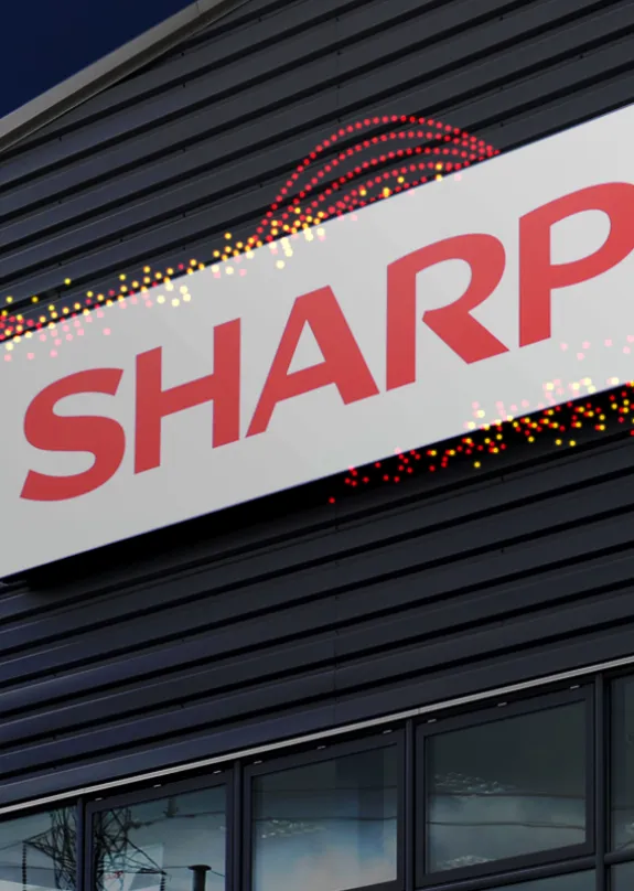 Large building with the sharp logo on